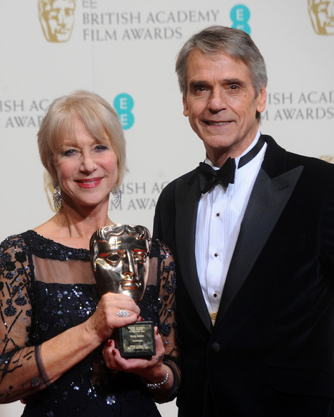 Dame Helen Mirren, winner of the Fellowship award, and actor Jeremy Irons pose in the winners room at the EE British Academy Film Awards 2014 at The Royal Opera House on February 16, 2014 in London, England. (February 15, 2014 - Source: Anthony Harvey/Getty Images Europe)